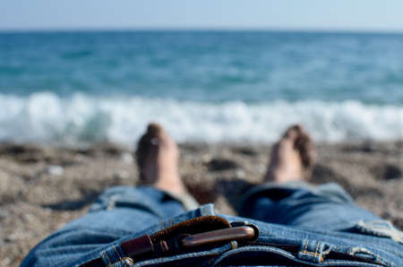 Blue jeans with brown leather beltの写真素材