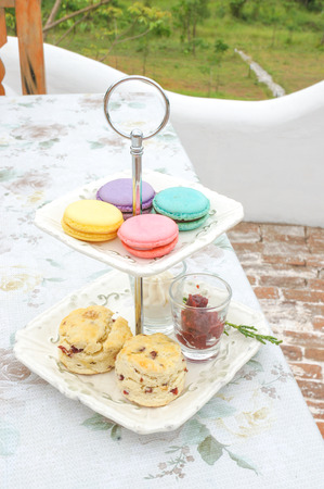 Macarons Scones on serving rackの写真素材