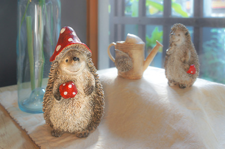 Mini Stone Sculpture of Porcupine, Selective Focus, Soft and Blur Background, Toned Photo.の写真素材