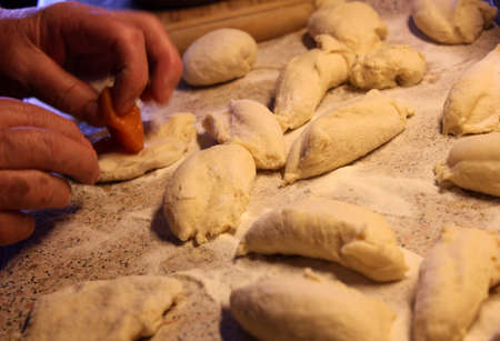 Homemade apricot dumplings, dough processingの写真素材