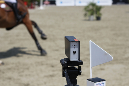 Starting timekeeper at show jumping competition, starting line with the timer