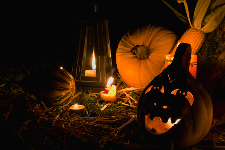Halloween pumpkins with lantern and candles, dark backgroundの写真素材