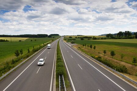 Highway transportation with cars and truck. View from above.の写真素材