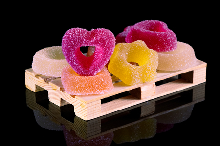 Colored jelly candies on a black background, sugared sweets. Various candy. の写真素材