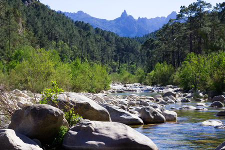 Small river in rocky hills in Col de Bavella mountains, Corsica, France. Inland on Corsica.の写真素材