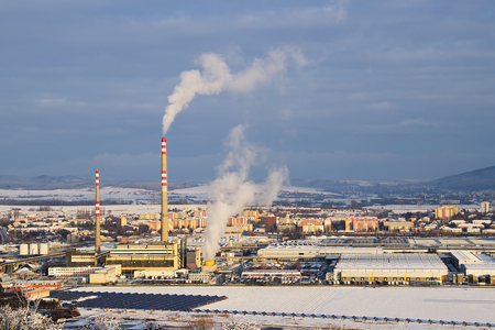 coal power plant with smoking chimneys and solar panels, ecological and outdated way of getting electricity. Air pollutionの写真素材