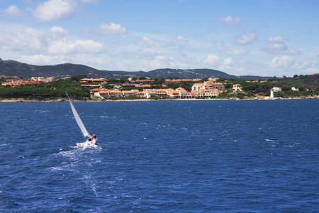 sailboat sailing to the Sardinian coast, sport yacht on Emerald coast at Sardegna island, Italyの写真素材