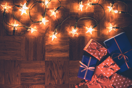 Christmas decoration with gift boxes and christmas star lights. Merry christmas greeting cardの写真素材