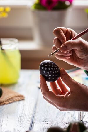 Painting Easter egg for traditional holiday celebrationの写真素材