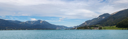 Wolfgangsee lake in Salzburger land, Upper Austria. St. Wolfgang town in panoramic landscape view at...