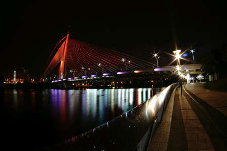 Putrajaya bridge in red with reflectionの素材