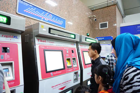 KL SENTRAL, KUALA LUMPUR-MARCH 21. 2015: Peoples purchasing trainのeditorial素材