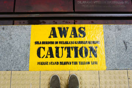 CAUTION sign at the floorの写真素材