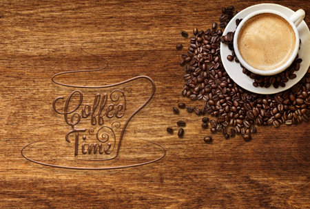 a cup of coffee and coffee bean on the wooden table top viewの写真素材