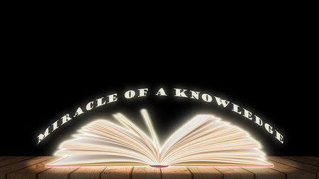 Open book on a wooden table and black background. Education concept.