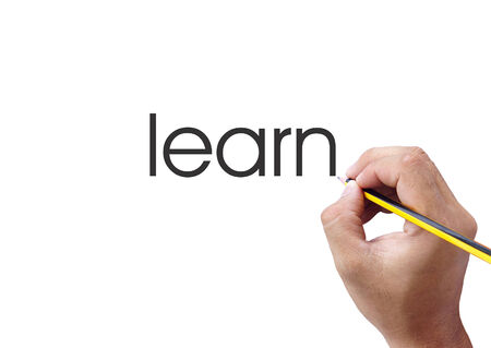 Human hand writing learn word on white backgroundの写真素材