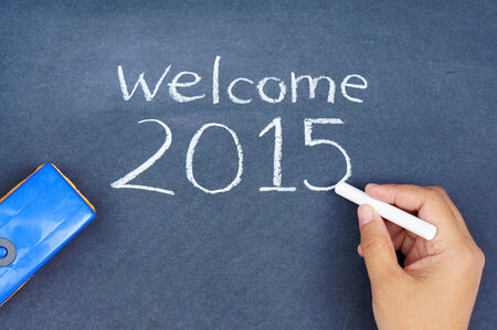 Human hand writing welcome 2015 on chalkboardの写真素材