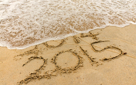Happy New Year 2015 replace 2014 year concept on the beachの写真素材