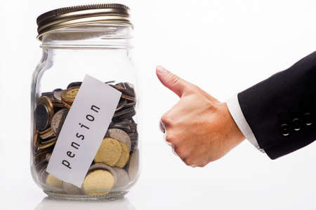 Pension note with money in cllear glass isolated on white