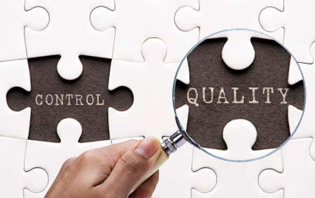 Magnifying glass searching missing puzzle peaces QualityControl