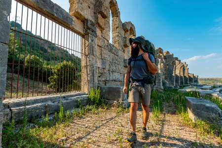 A hiker in Perge (Perga Ancient City) Ancient City and Ruins.の写真素材