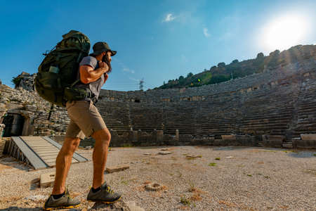 A hiker in Perge (Perga Ancient City) Ancient City and Ruins.の写真素材
