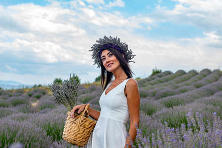Turkey's lavender paradise: Kuyucak Village, Isparta - Turkey. Beautiful woman in the lavander field of the Kuyucak Isparta. Woman model is walking through lavender fields.の写真素材