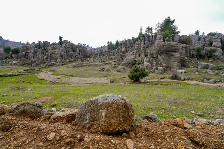 Majestic view of valley with beautiful rock formations on an autumn day. Adamkayalar, Selge, Manavgat, Antalya, Turkey.の写真素材