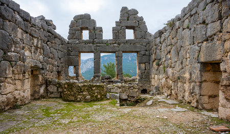 Remains of gymnasium in acnient Lycian city Arycanda. Ancient city on mountain near Aykiricay village.Well preserved semi-circular theater of Arycanda, ancient Lycian city in Antalの写真素材