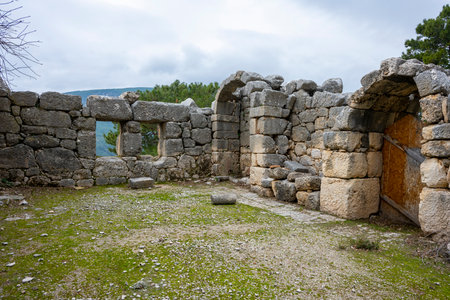 Remains of gymnasium in acnient Lycian city Arycanda. Ancient city on mountain near Aykiricay village.Well preserved semi-circular theater of Arycanda, ancient Lycian city in Antalの写真素材