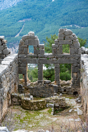 Remains of gymnasium in acnient Lycian city Arycanda. Ancient city on mountain near Aykiricay village.Well preserved semi-circular theater of Arycanda, ancient Lycian city in Antalの写真素材