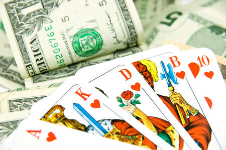 Poker Game with Royal Flush lying on Pot with dollarsのeditorial素材