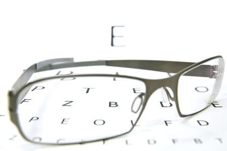pair of glasses lying on an eyesight test