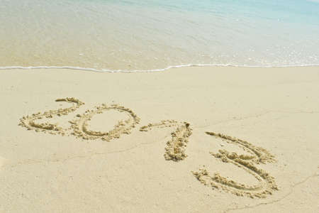 2013 written in sand on beachの写真素材