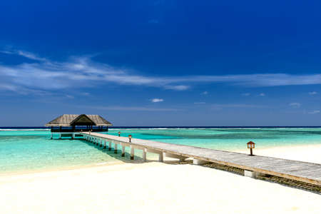footbridge over turquoise indian oceanの写真素材
