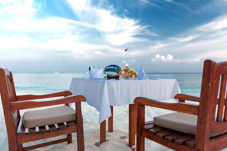 private dinner at a beach on the maldivesの写真素材