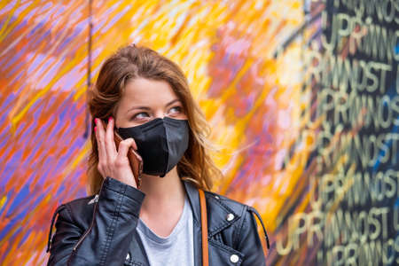 European woman travel wearing face protection agains coronavirusの写真素材