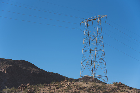 Overhead Power Lines On A Desert Hillの写真素材