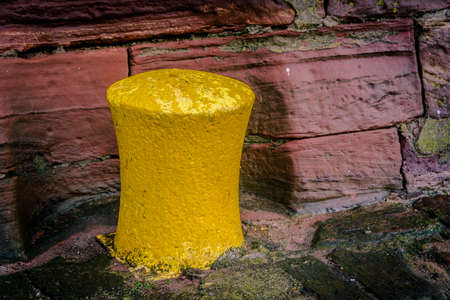 Yellow bollard at the old harbor of dunbar, scottlandの写真素材
