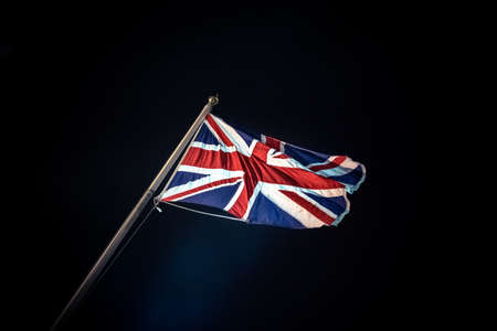 Union Jack flag against black backgroundの写真素材