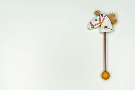 whitewood horsehead on stick vintage toy isolated on white backgroundの写真素材