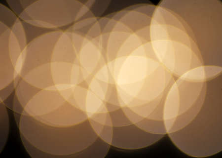 holidays, luxury and backgroundConcept - blurred golden christmas lights bokeh