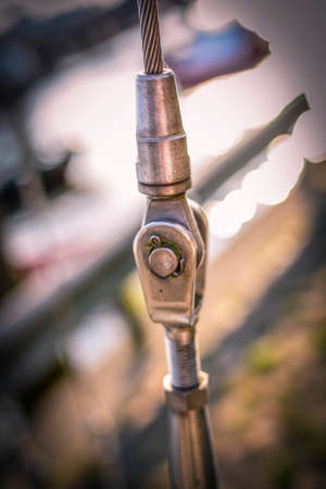 Closeup connection of steel wire rope sling with blurry background harborの写真素材