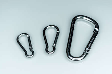 close up shot of gray aluminum carabiner isolated on a white backgroundの写真素材