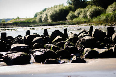 Beautiful seashore with stones on the beach on the foreground, South Australiaの写真素材