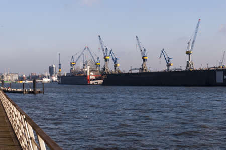 Hamburg ships and river joint in the background photography of Hamburg district at Hamburg harbor in daylightの写真素材