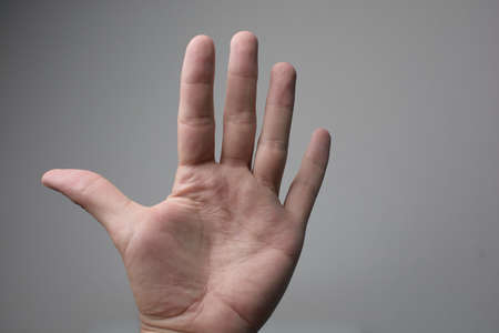Hand showing sign on white backgroundの写真素材