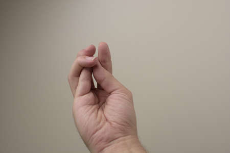 Hand showing sign on white backgroundの写真素材