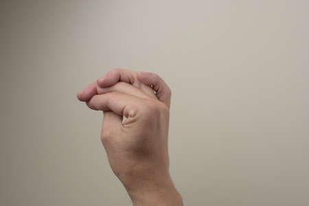 Hand showing sign on white backgroundの写真素材