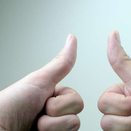 Hand showing sign on white backgroundの写真素材